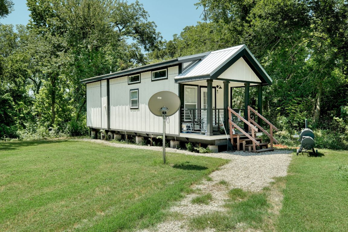 1660 South FM 1660 Taylor, TX 76574 - Photo 14 of 25 a view of house with backyard and garden