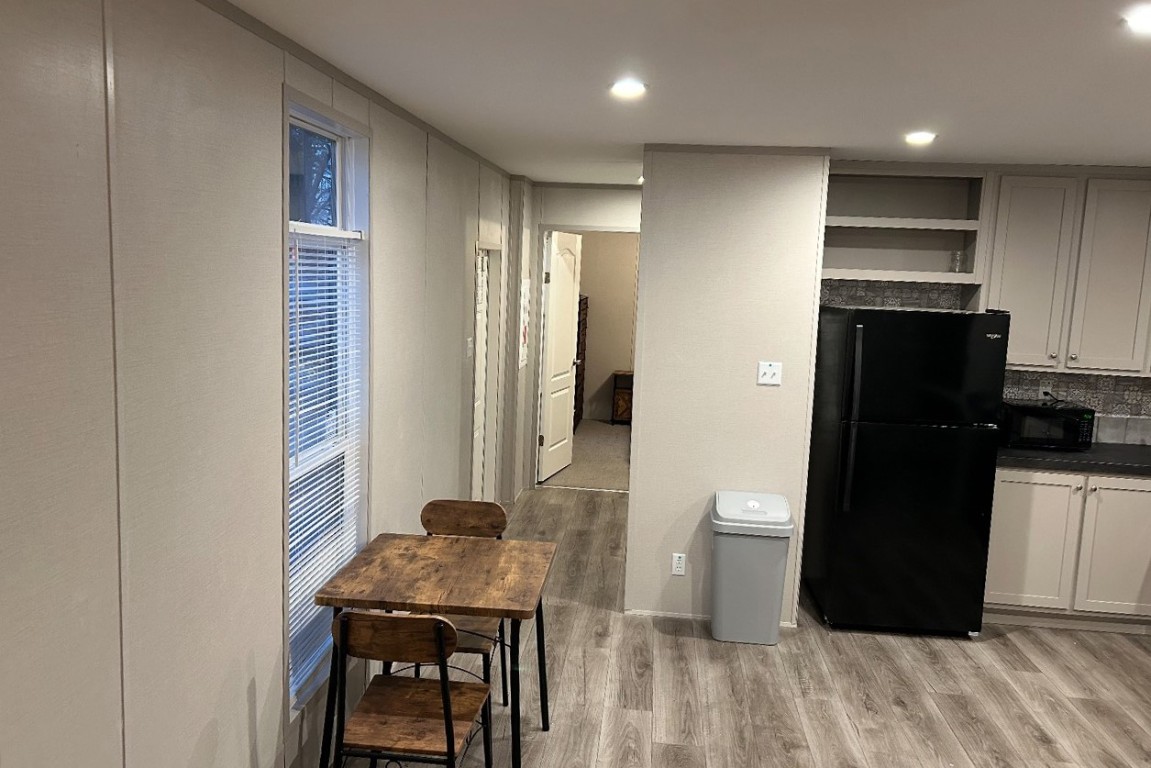 1660 South FM 1660 Taylor, TX 76574 - Photo 19 of 25 a view of a kitchen with a refrigerator and a window