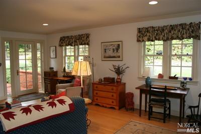 7 N Road Ross, CA 94957 - Photo 5 of 12 a living room with furniture and large windows