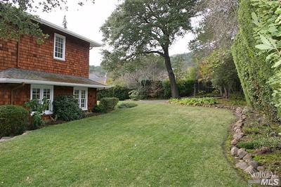 7 N Road Ross, CA 94957 - Photo 8 of 12 a view of a house with backyard and garden