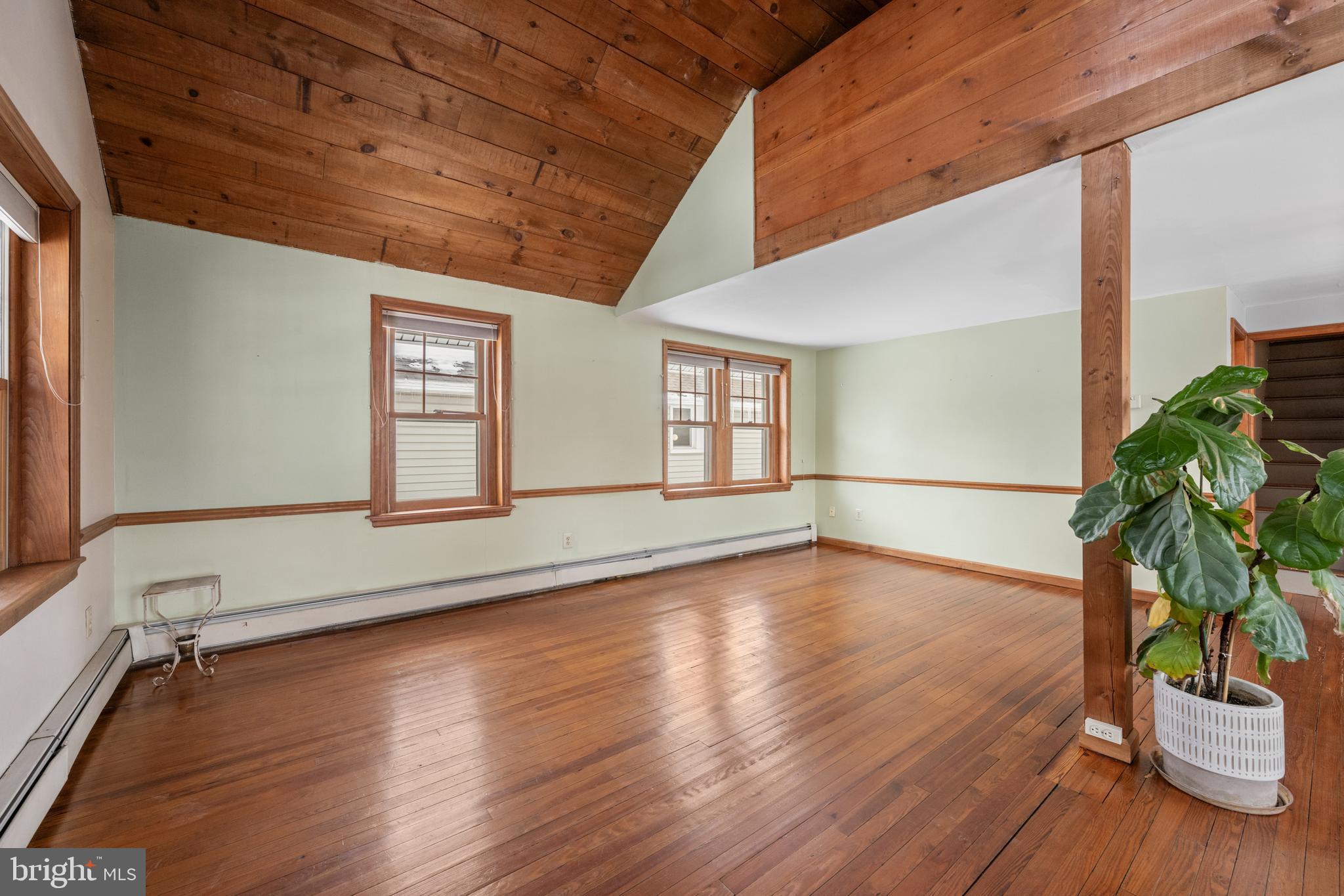 691 Park Road Lansdale, PA 19446 - Photo 17 of 50 a view of an empty room with wooden floor and a window