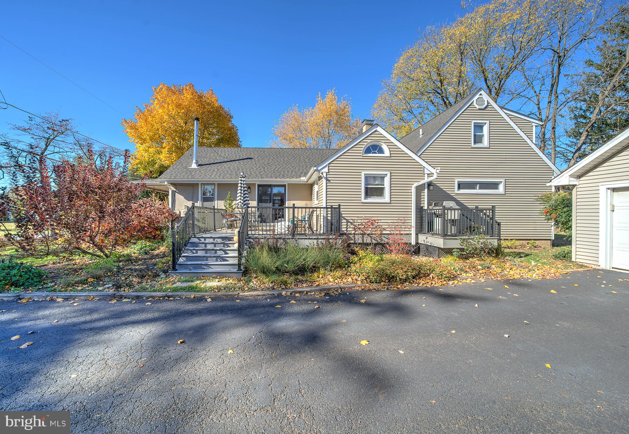 691 Park Road Lansdale, PA 19446 - Photo 10 of 50 a front view of a house with a yard and garage