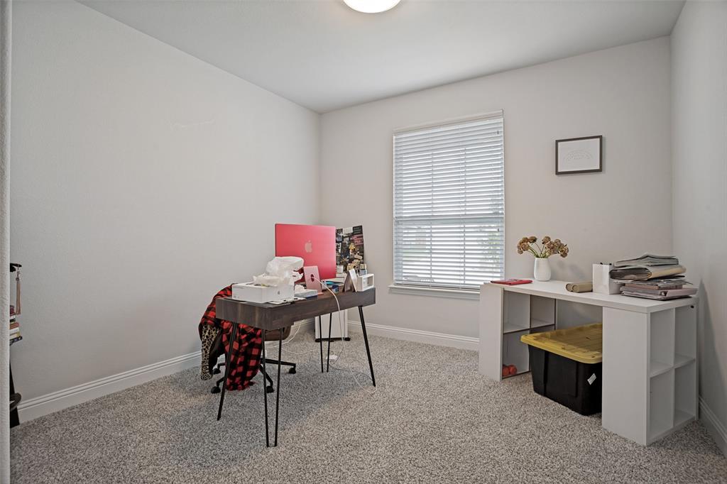 3115 Giovanni Point Princeton, TX 75407 - Photo 13 of 26 Carpeted interior room with a window featuring blinds, a built-in overhead light fixture, and white baseboards