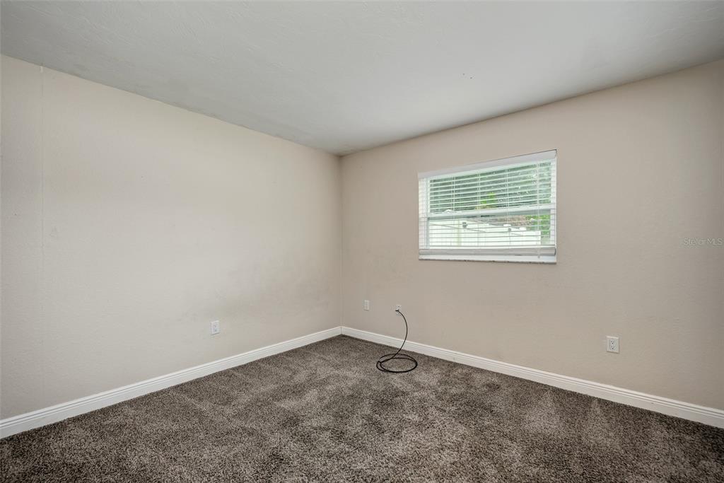 1330 Georgetowne Circle Sarasota, FL 34232 - Photo 31 of 46 an empty room with a window