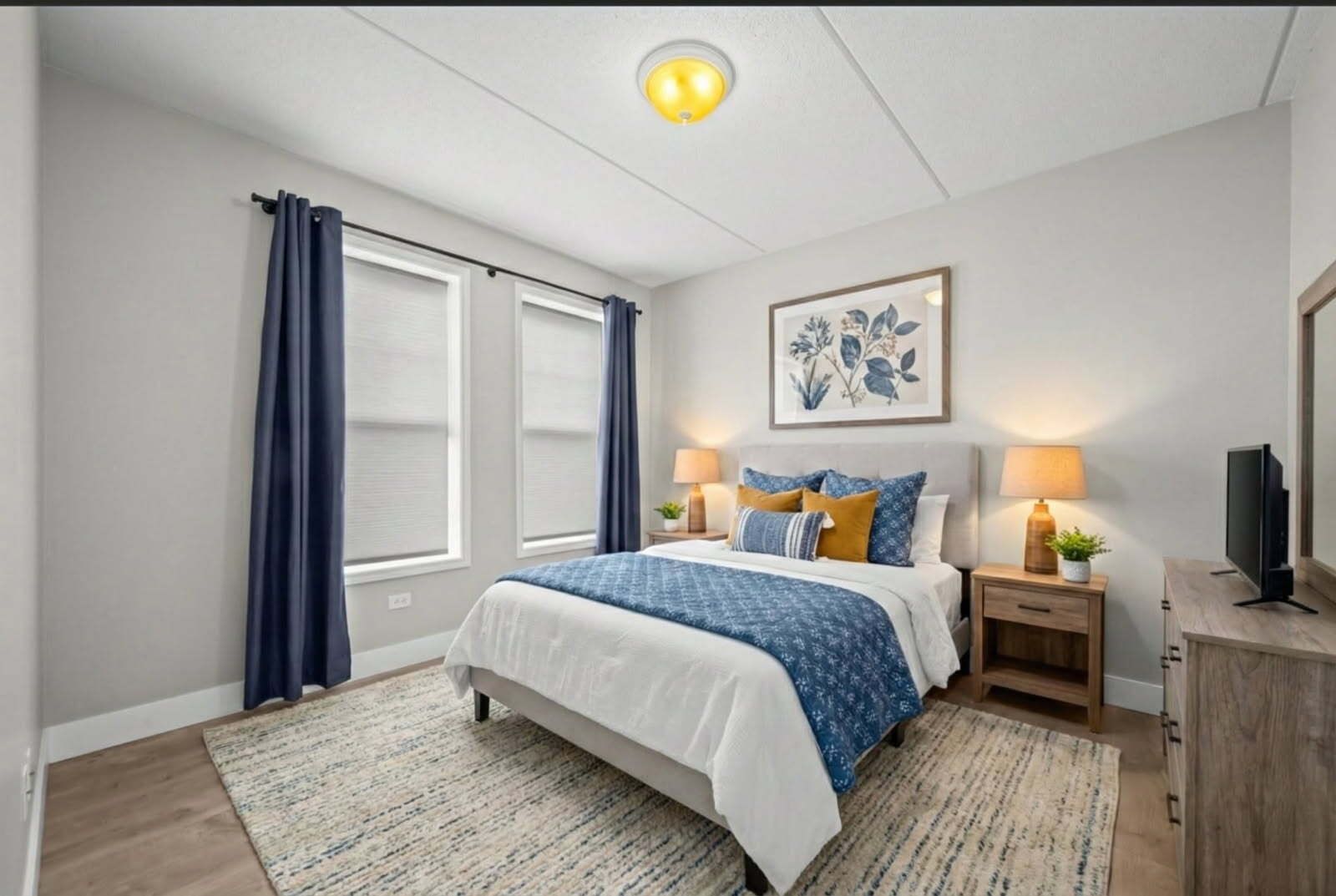 133 West Palatine Road, Unit 107A Palatine, IL 60067 - Photo 6 of 21 a bedroom with a bed and a flat screen tv