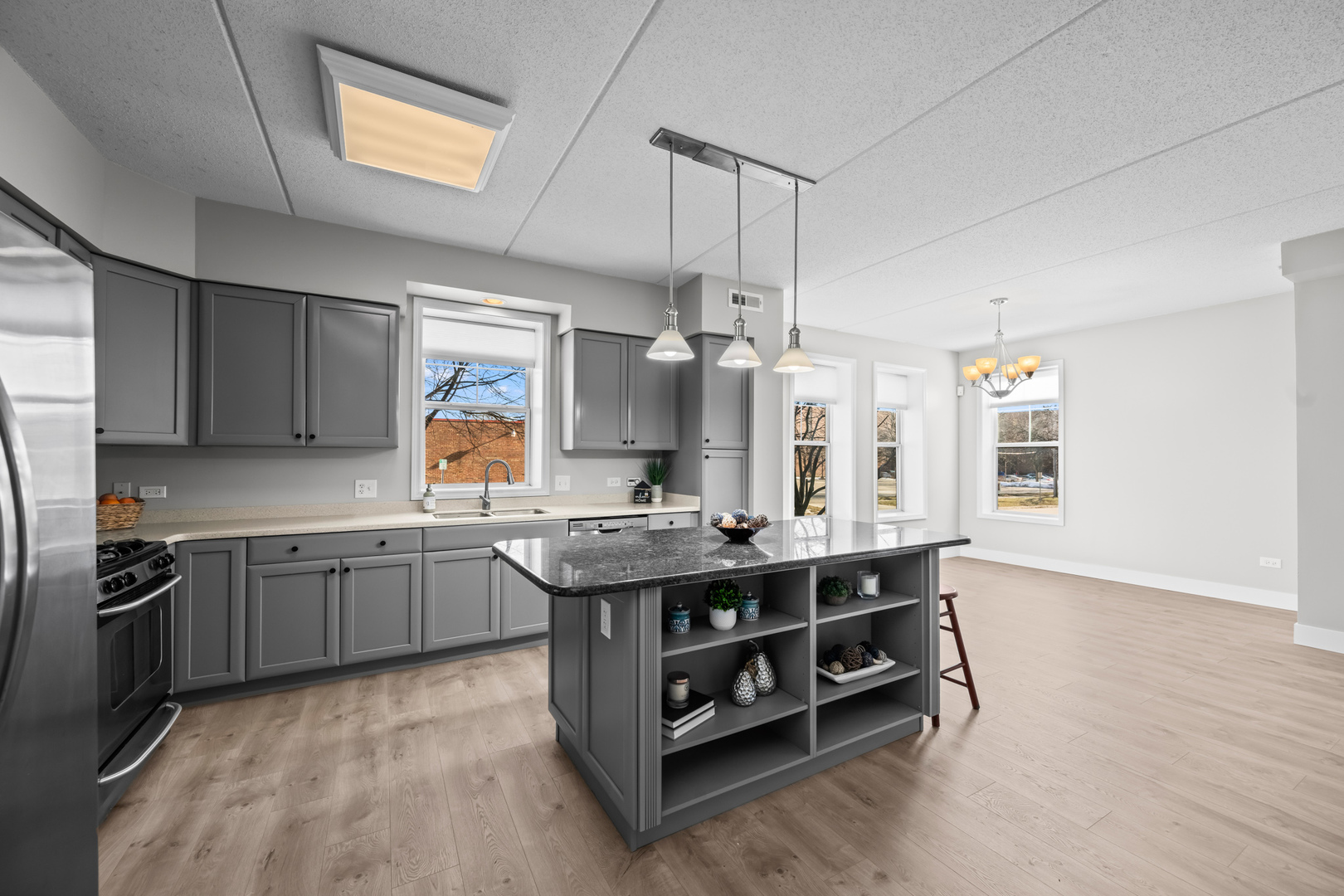 133 West Palatine Road, Unit 107A Palatine, IL 60067 - Photo 7 of 16 a kitchen with stainless steel appliances granite countertop a sink stove and refrigerator