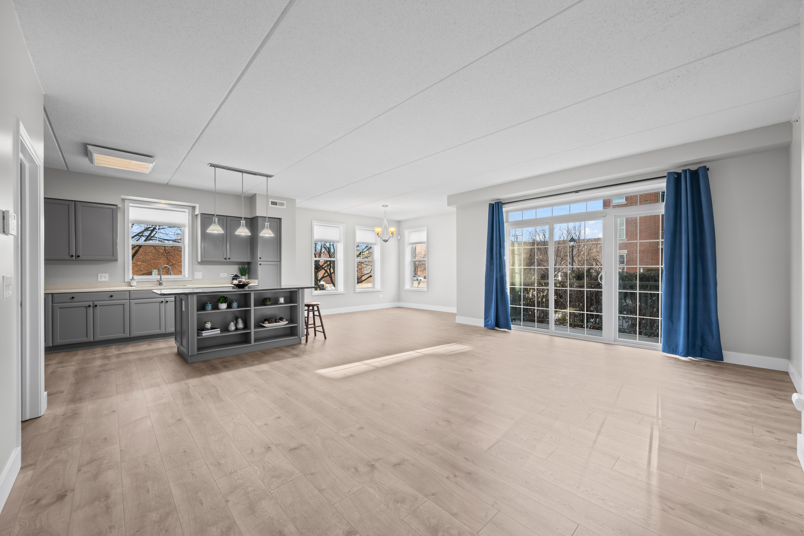 133 West Palatine Road, Unit 107A Palatine, IL 60067 - Photo 7 of 21 a view of a livingroom with furniture and a flat screen tv