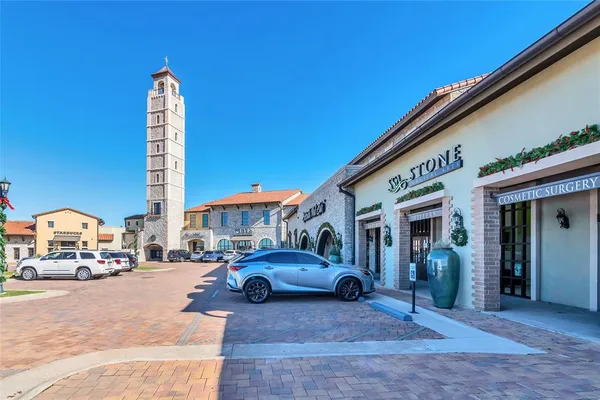 a city street lined with buildings and cars
