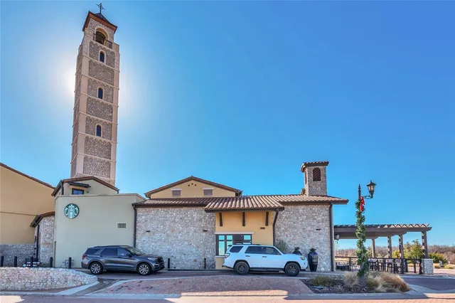 a front view of a building with parking