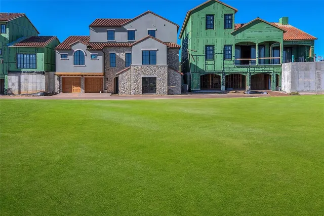 a front view of building with yard