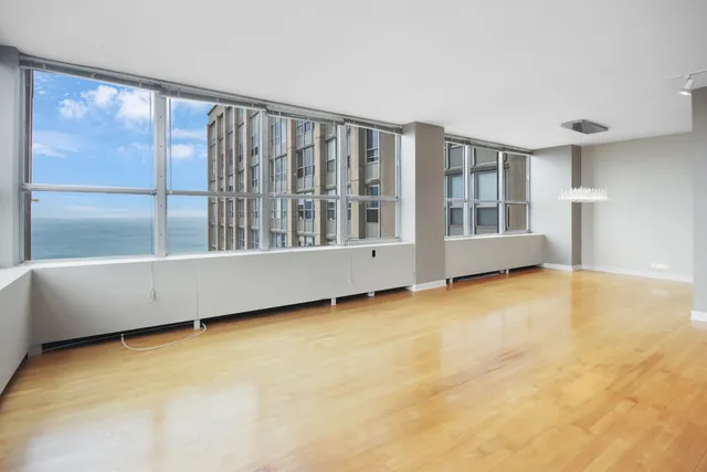 a view of an empty room with a window