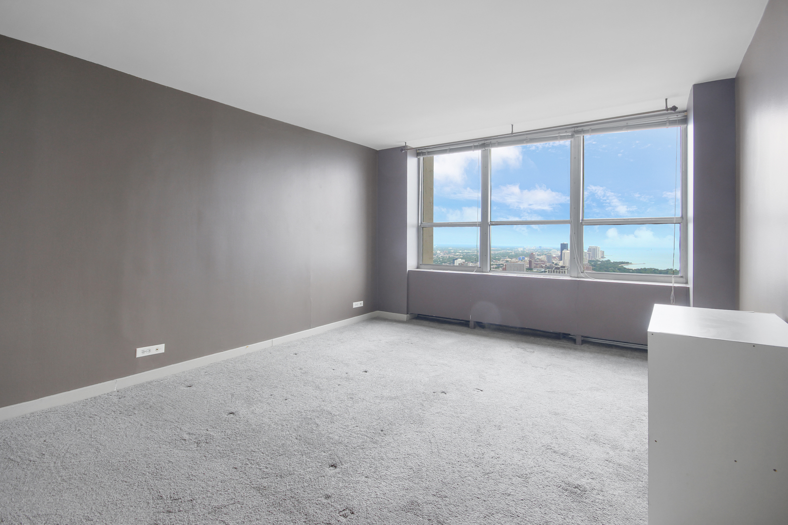 655 West Irving Park Road, Unit 5310 Chicago, IL 60613 - Photo 10 of 12 a view of an empty room with a window