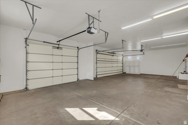 691 Rainier Drive St. George, UT 84770 - Photo 16 of 24 Garage featuring a garage door opener