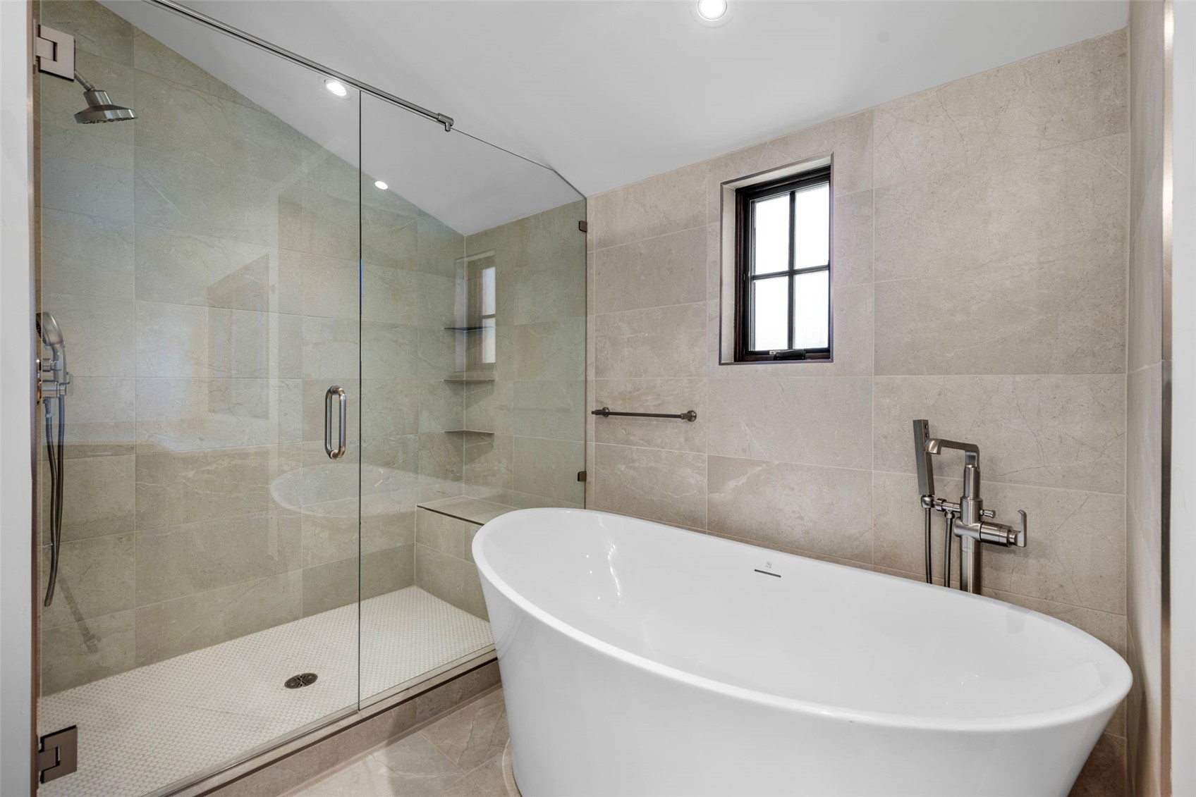 312 3rd Avenue, Unit 1 Frisco, CO 80443 - Photo 23 of 42 a white bath tub sitting next to a shower