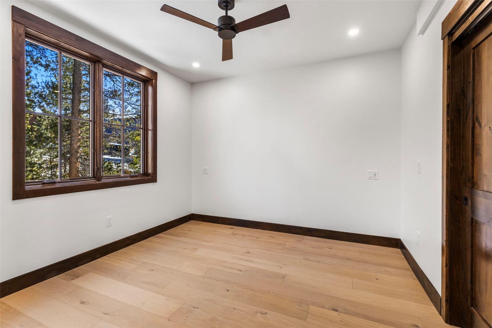 312 3rd Avenue, Unit 1 Frisco, CO 80443 - Photo 25 of 42 a view of an empty room with a window and a ceiling fan