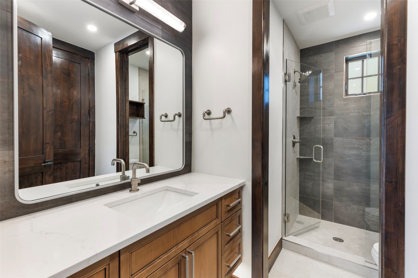 312 3rd Avenue, Unit 1 Frisco, CO 80443 - Photo 27 of 42 a bathroom with a shower sink and mirror