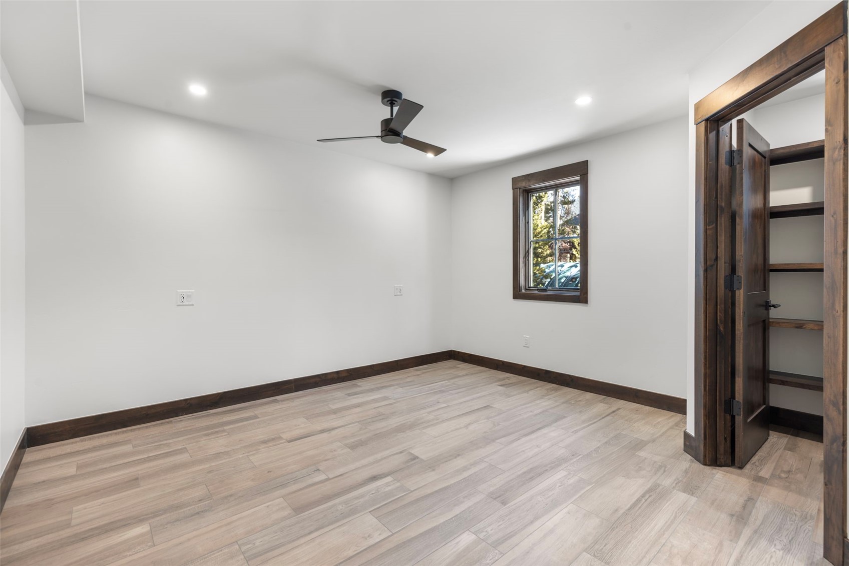 312 3rd Avenue, Unit 1 Frisco, CO 80443 - Photo 34 of 42 an empty room with wooden floor and windows