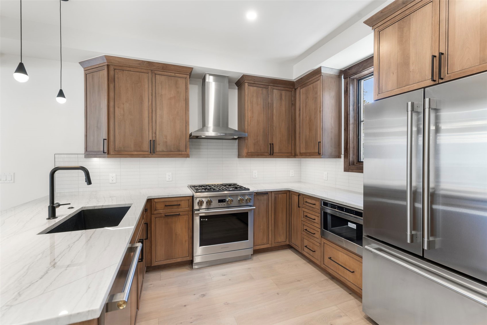 312 3rd Avenue, Unit 1 Frisco, CO 80443 - Photo 4 of 42 a kitchen with stainless steel appliances granite countertop a sink stove and refrigerator