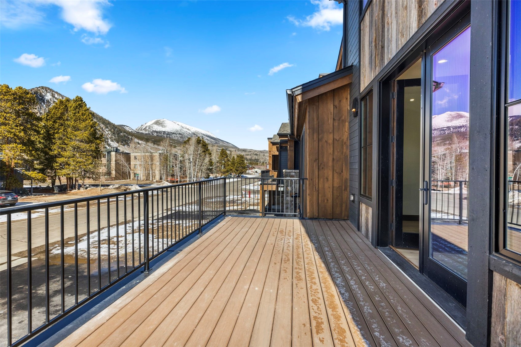 312 3rd Avenue, Unit 1 Frisco, CO 80443 - Photo 10 of 42 Large deck off living room for entertaining facing west.