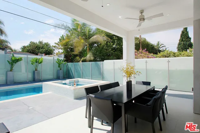 a outdoor dining space with furniture and garden view