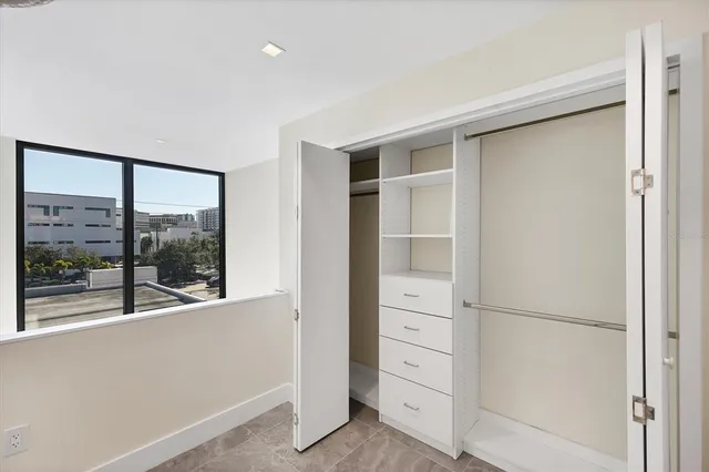 a room with wooden cabinets and sink