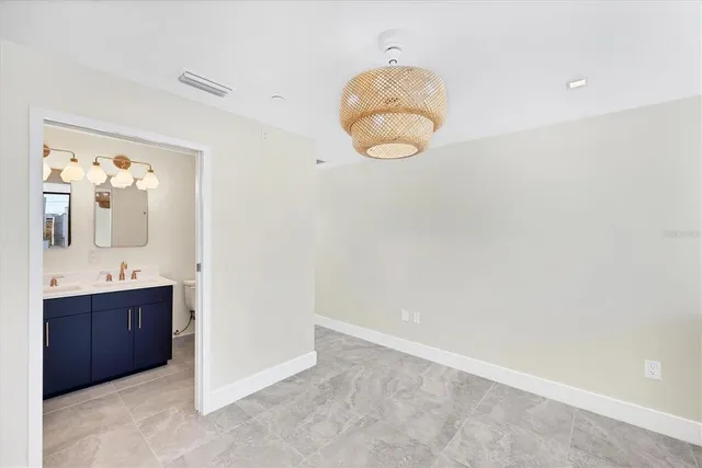 a bathroom with a sink vanity and mirror