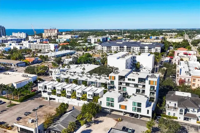 an aerial view of a house with a lake view