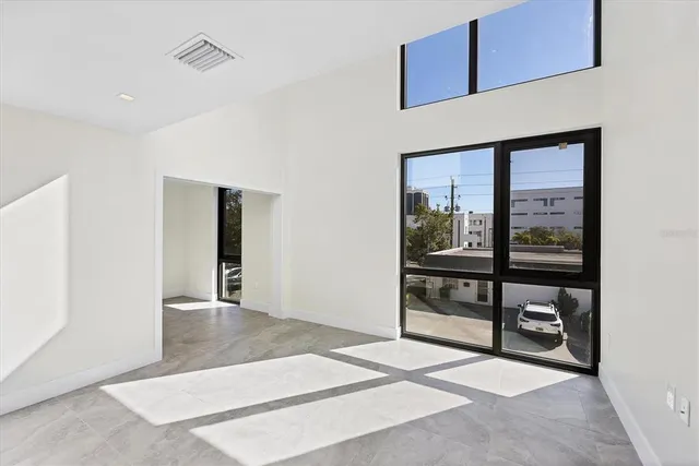 a view of an entryway with wooden floor and door
