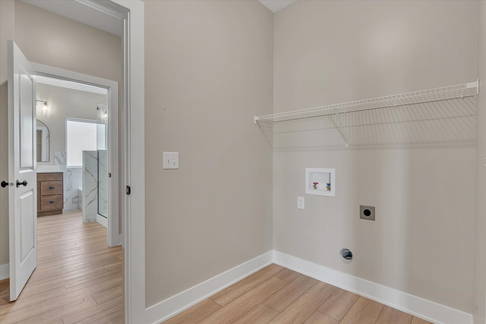 455 Rhonda Road New Liberty, IA 52765 - Photo 38 of 54 a view of a hallway with wooden floor