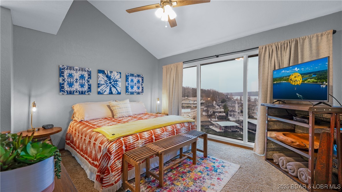 2500 Bay Point Lane, Unit 645 Osage Beach, MO 65065 - Photo 7 of 48 Lakefront primary bedroom with vaulted ceilings