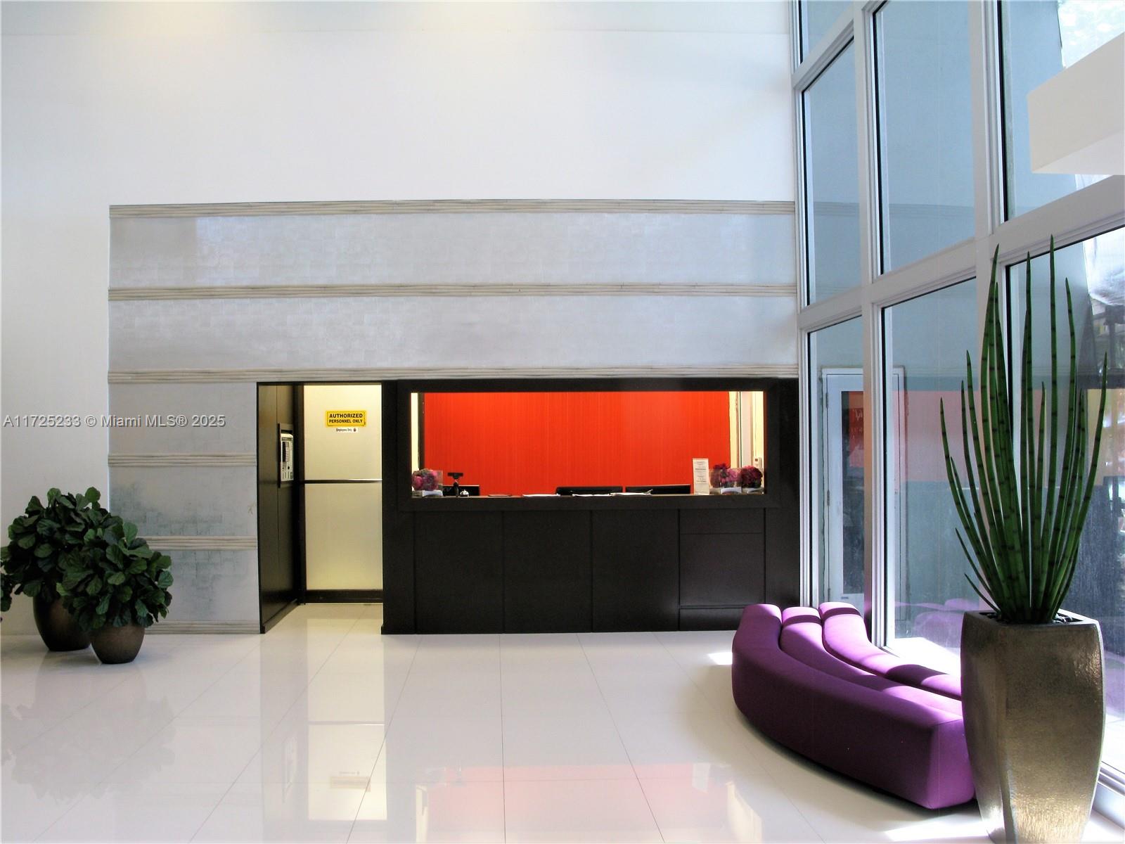 5701 Collins Avenue, Unit 1011 Miami Beach, FL 33140 - Photo 28 of 46 a living room with furniture