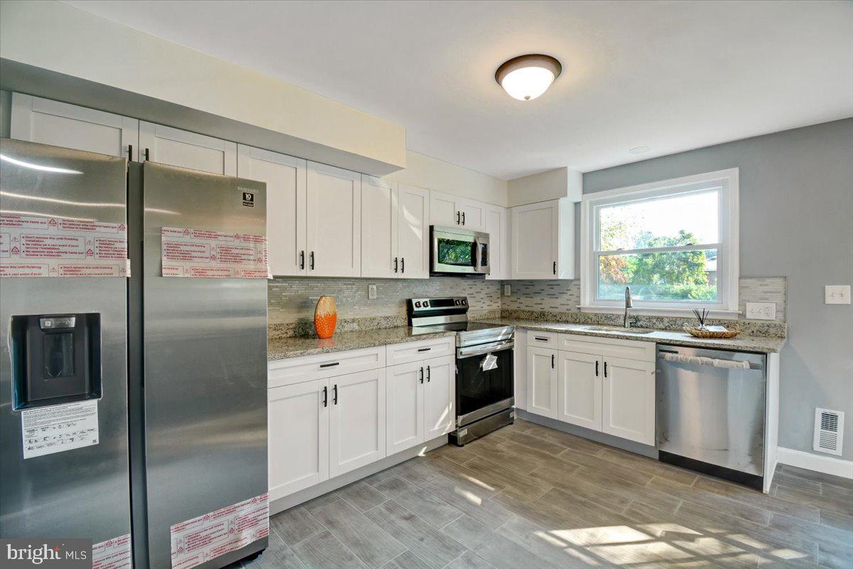 5922 Baltimore Street Baltimore, MD 21207 - Photo 1 of 31 Top to bottom renovations. Brand new kitchen, bath