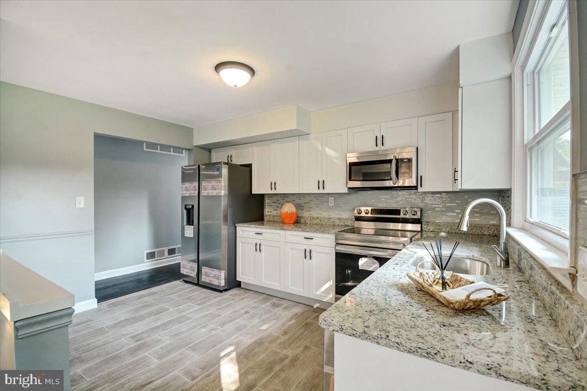 5922 Baltimore Street Baltimore, MD 21207 - Photo 2 of 31 Granite counter top. Stainless steel appliances