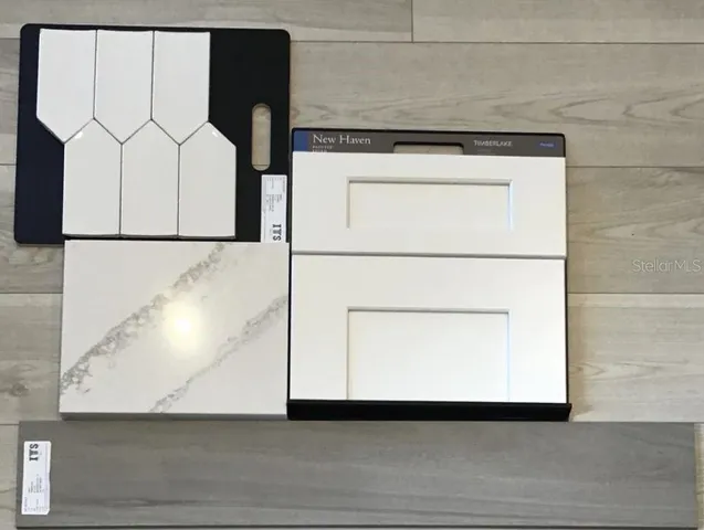 a living room with furniture a bookshelf and a window