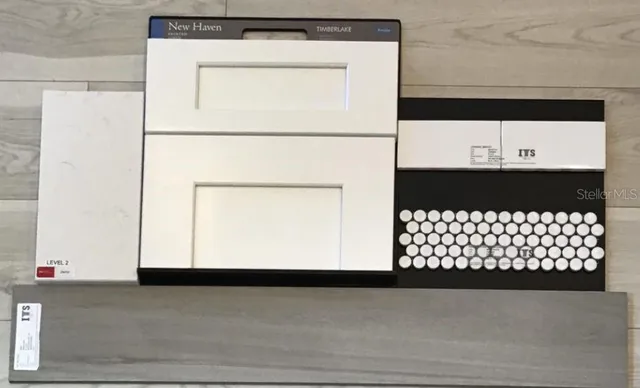 a view of a dining room with furniture a chandelier and wooden floor