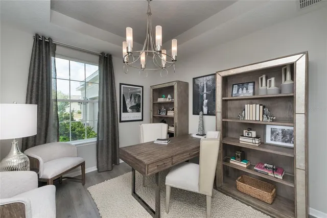 a kitchen with stainless steel appliances granite countertop a sink a stove and a wooden floors