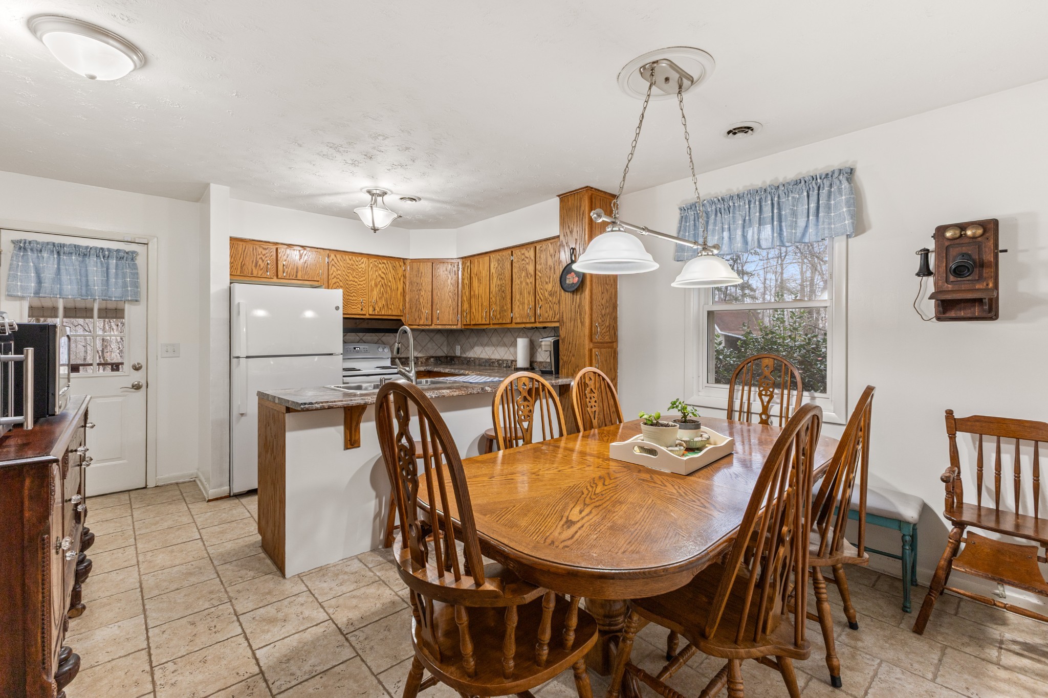 392 Feather Ridge Road Charlotte, TN 37036 - Photo 11 of 31 a view of a dining room with furniture