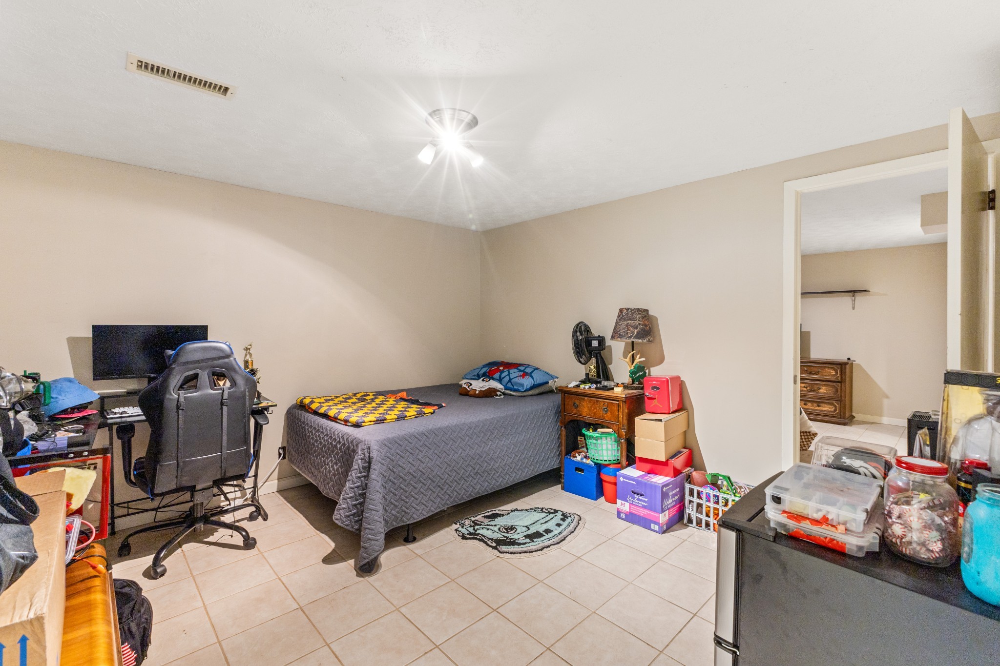392 Feather Ridge Road Charlotte, TN 37036 - Photo 17 of 31 a bedroom with furniture and a wooden floor