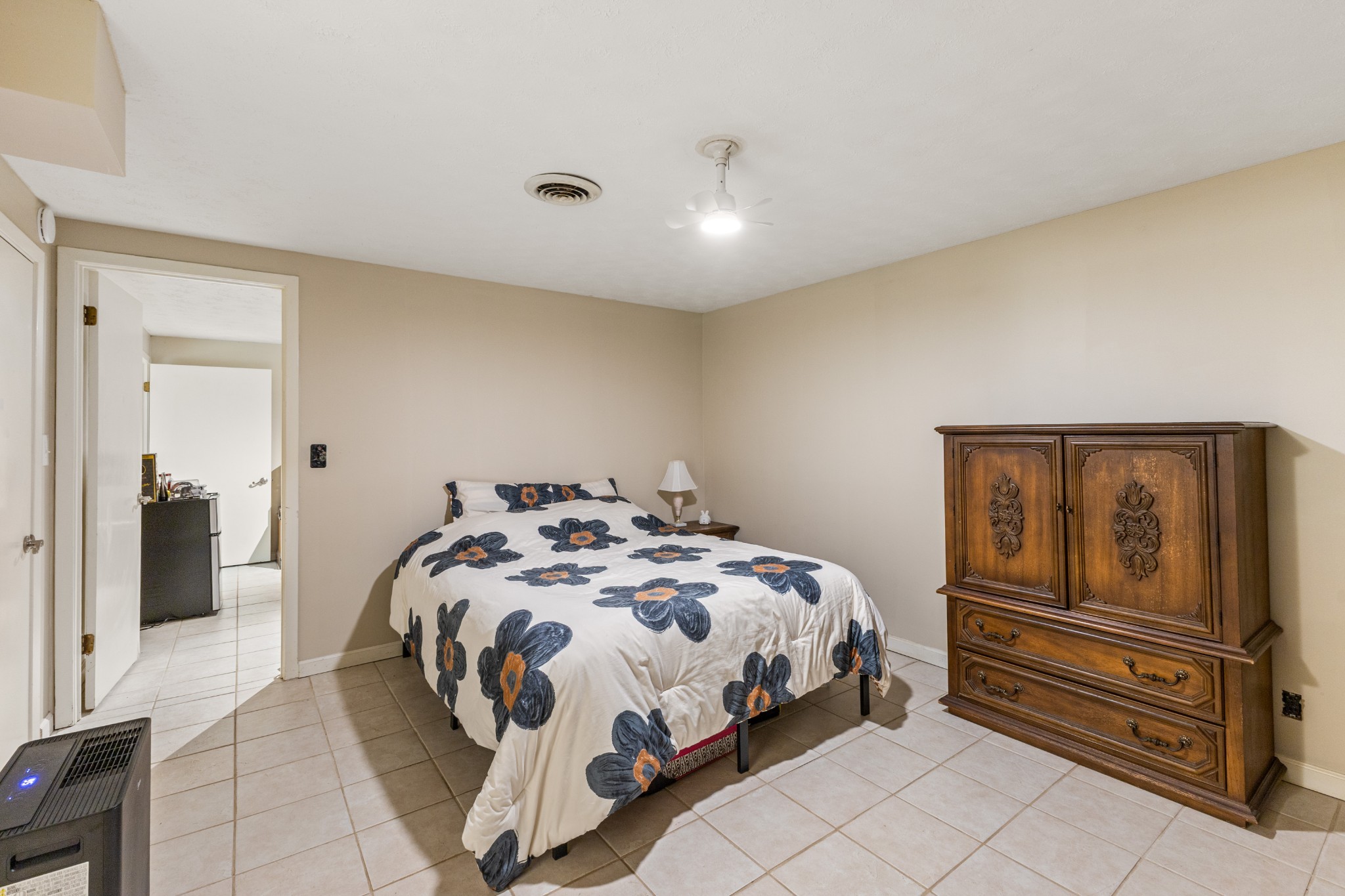 392 Feather Ridge Road Charlotte, TN 37036 - Photo 20 of 31 a bedroom with a bed and dresser