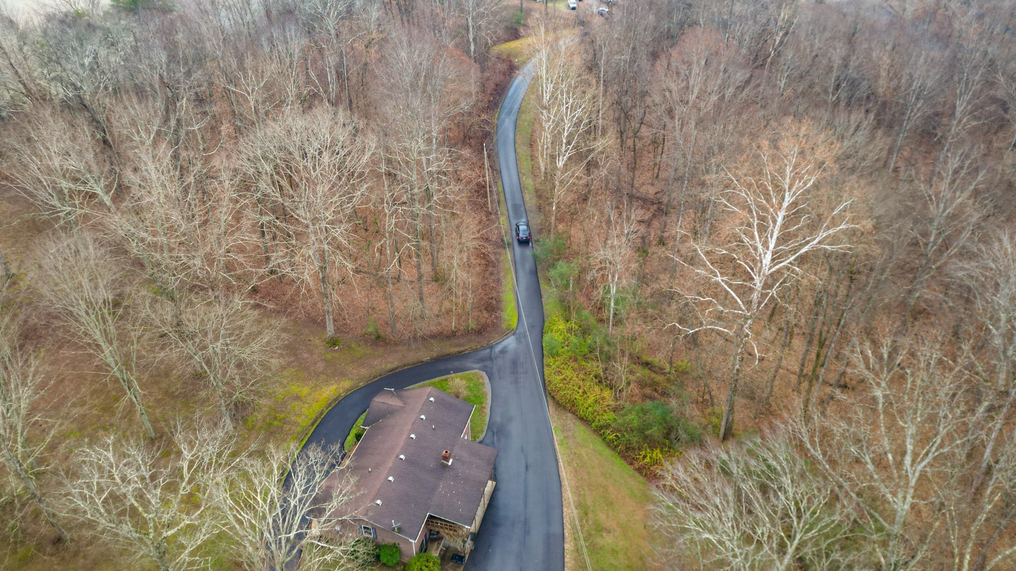 392 Feather Ridge Road Charlotte, TN 37036 - Photo 31 of 31 a bathroom with a shower