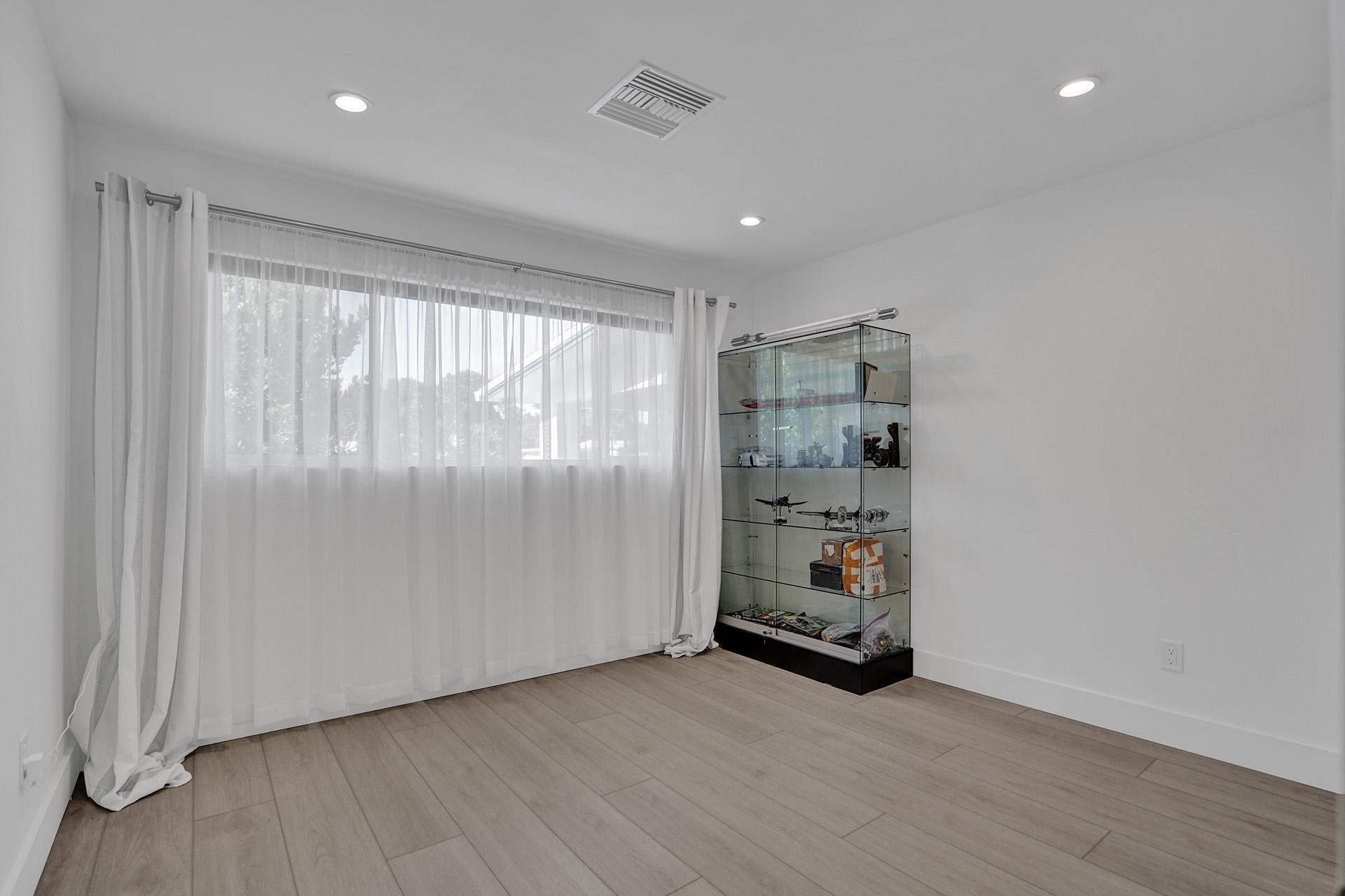 2425 Southeast 6th Street Pompano Beach, FL 33062 - Photo 14 of 18 wooden floor in an empty room with a window
