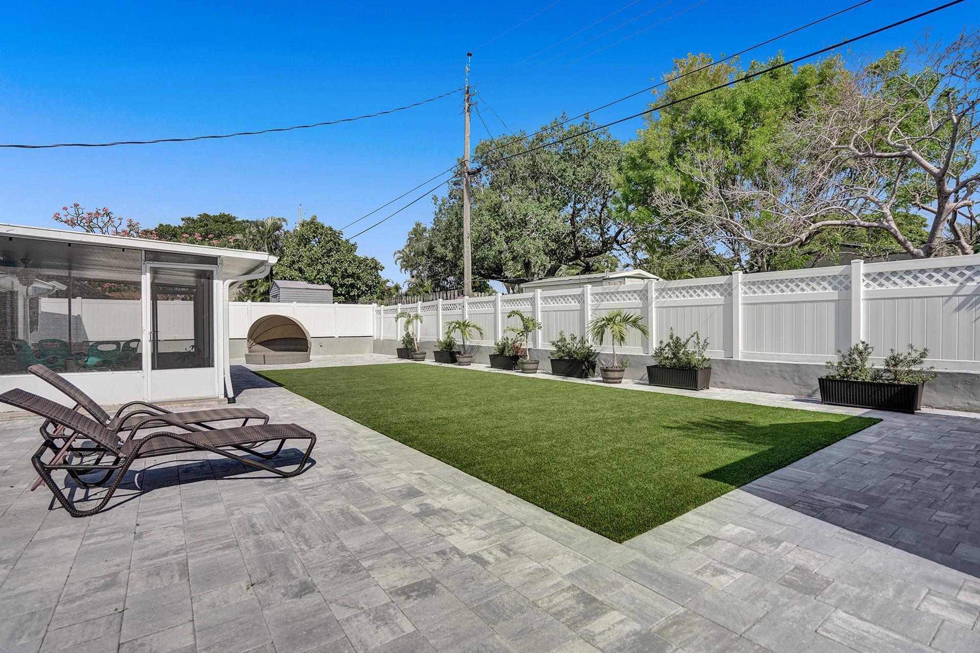 2425 Southeast 6th Street Pompano Beach, FL 33062 - Photo 18 of 18 a view of a patio with table and chairs and potted plants