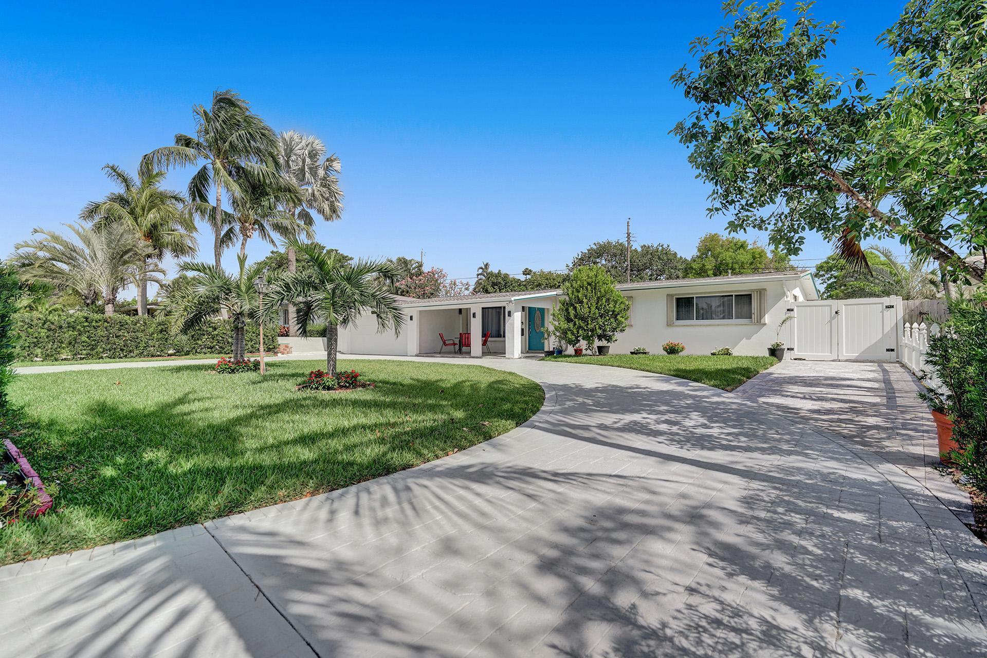 2425 Southeast 6th Street Pompano Beach, FL 33062 - Photo 5 of 18 a front view of a house with a yard and a street