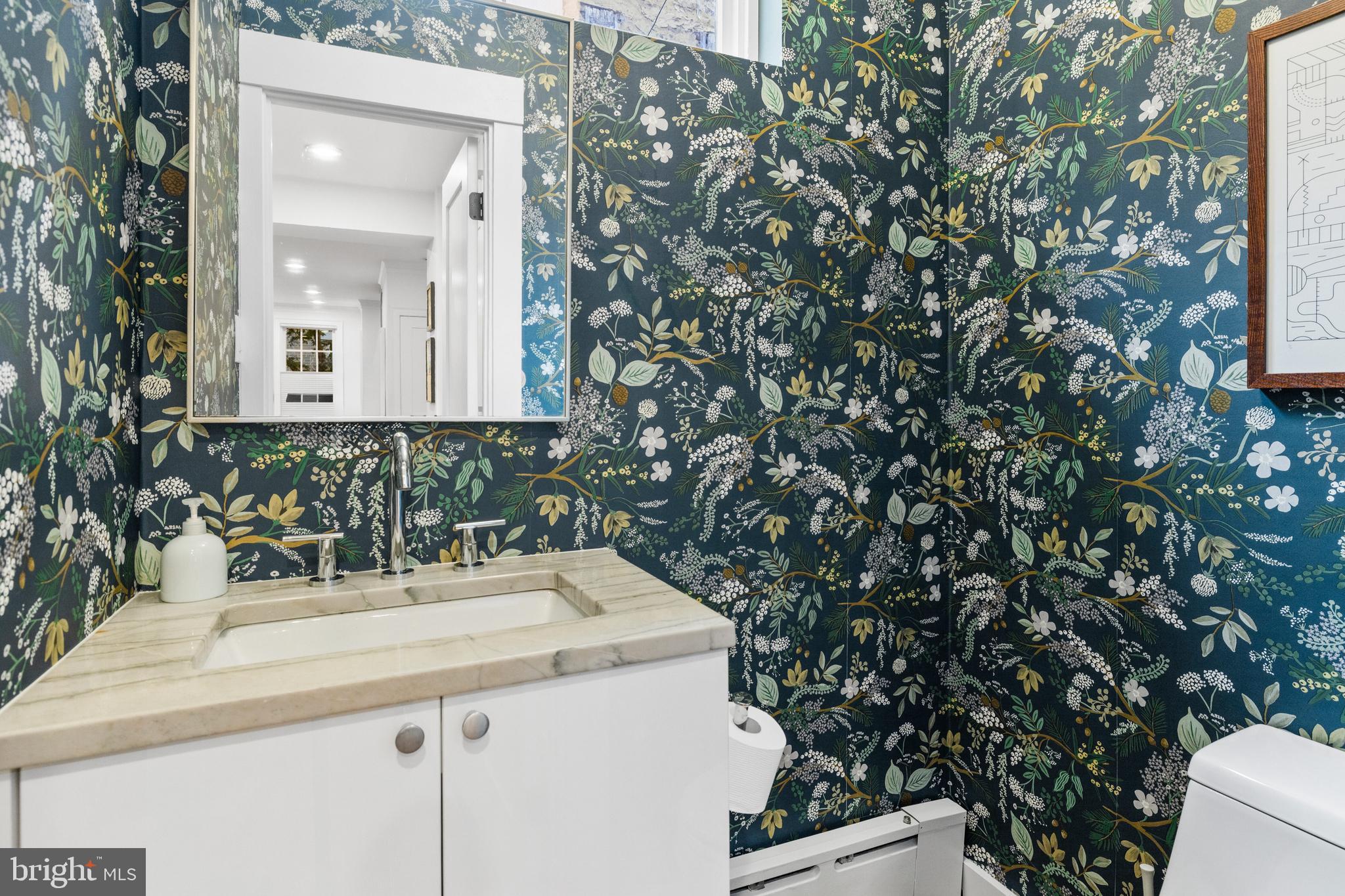 340 South Smedley Street Philadelphia, PA 19103 - Photo 13 of 38 a bathroom with a sink and a mirror