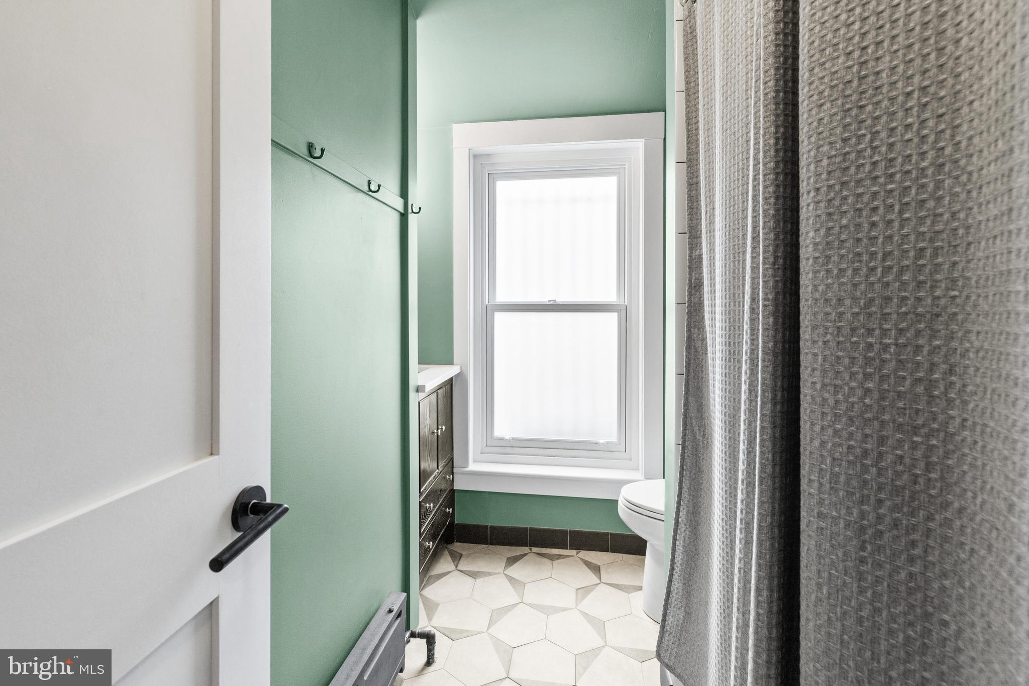 340 South Smedley Street Philadelphia, PA 19103 - Photo 31 of 38 a bathroom with a window and a toilet
