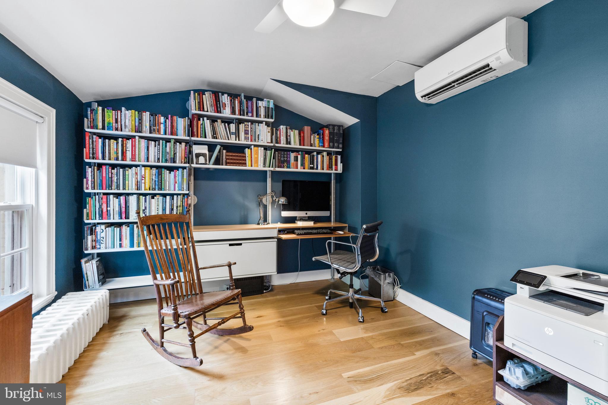 340 South Smedley Street Philadelphia, PA 19103 - Photo 33 of 38 a view of a workspace with furniture and a bookshelf