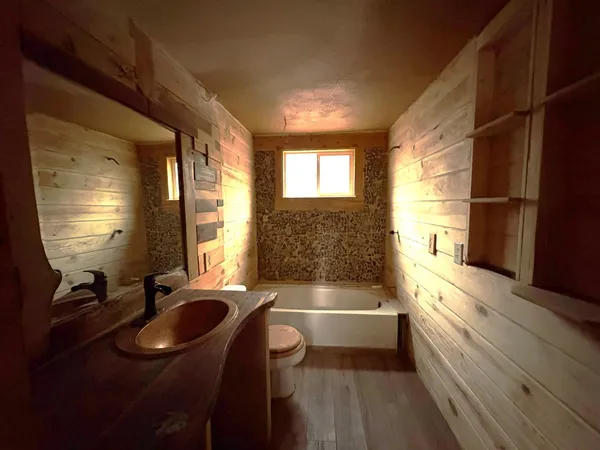a bathroom with a sink a bathtub and a shower