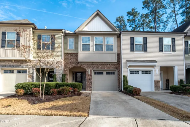 a view of a house with windows and plants
