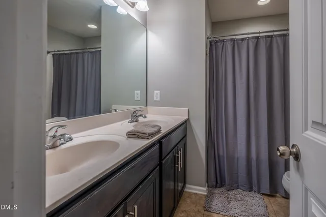 a bathroom with a sink and mirror