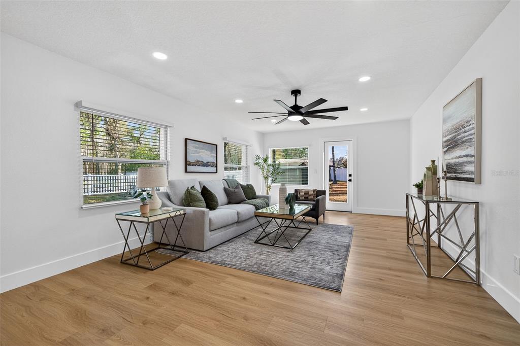 1120 Country Lane Lutz, FL 33558 - Photo 19 of 52 a living room with furniture and a wooden floor
